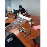 Wrapping a desktop using stretch film for relocation