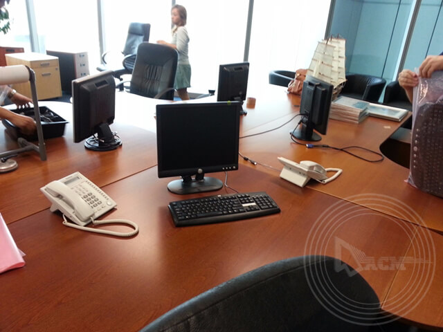 Desktops and keyboards relocated and set up in a new office