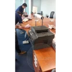 A printer ready to be wrapped and packed for office relocation