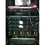 A close up photo of a computer server with two tapes on it