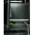 A desktop and a keyboard on a rack