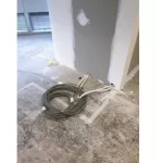 A bundle of wires on dirty cement floor