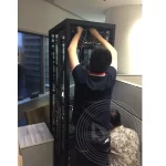 An IT technician is setting up the computer server