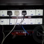 3 pin plug on extension cord in server rack