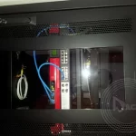 An image of cable plugged into server in one of the housing