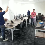 IT technician packing computer hardware and office appliances for office relocation