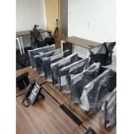 Desktops are wrapped on a table for office relocation
