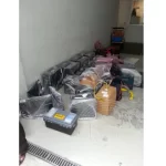 Wrapped and packed computer hardware on the floor