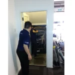 IT technician setting up a small server room