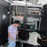 Two technicians were setting up the cable routing