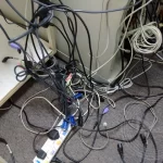 Messy wires and extension cord on the floor